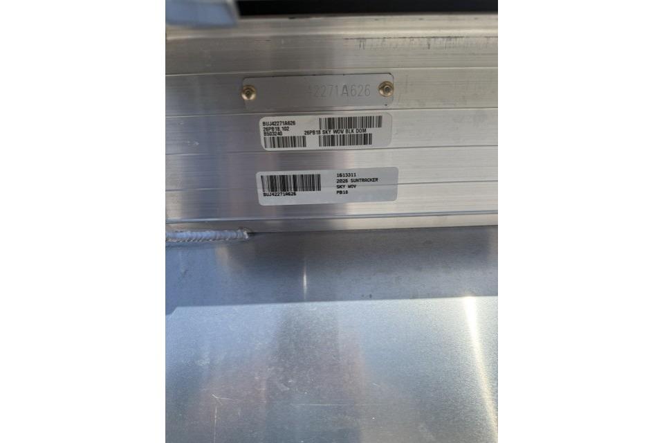 2026 Sun Tracker Party Barge 18 DLX identification plate with barcodes and serial numbers.