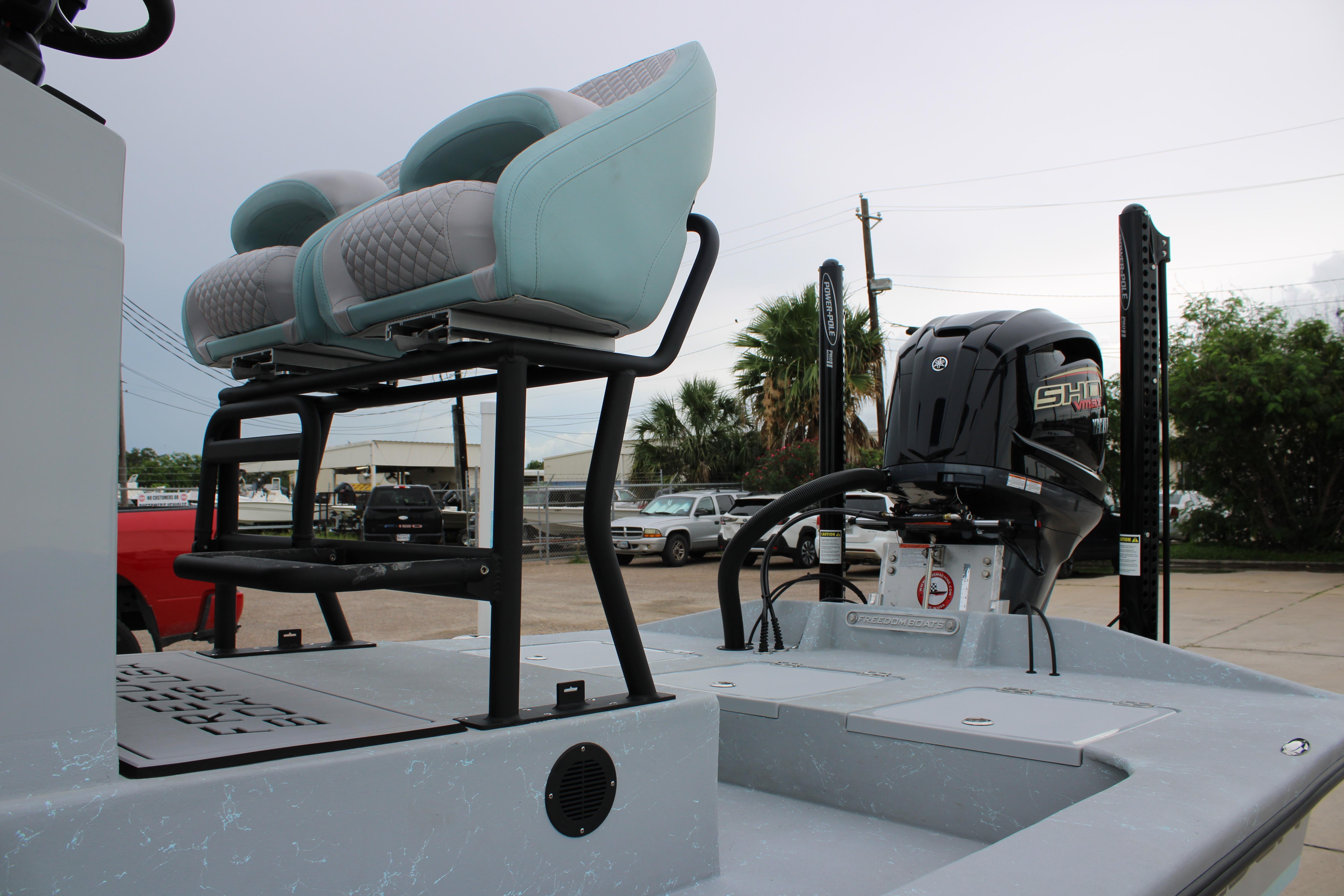 2026 Freedom Boats 24 Defender with dual seats and powerful outboard motor.