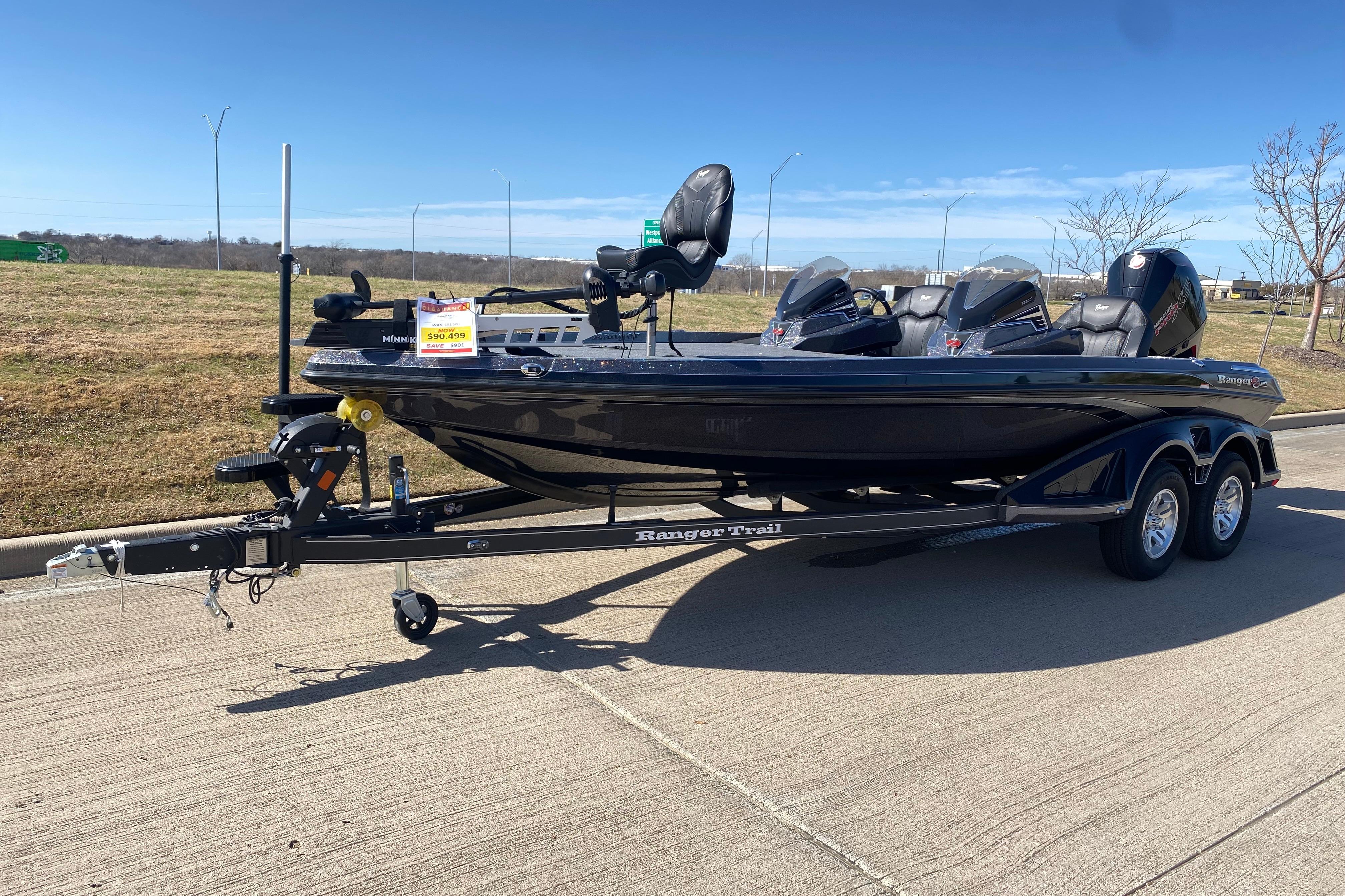 2025 Ranger Z520 boat on trailer, parked outdoors under clear blue sky.