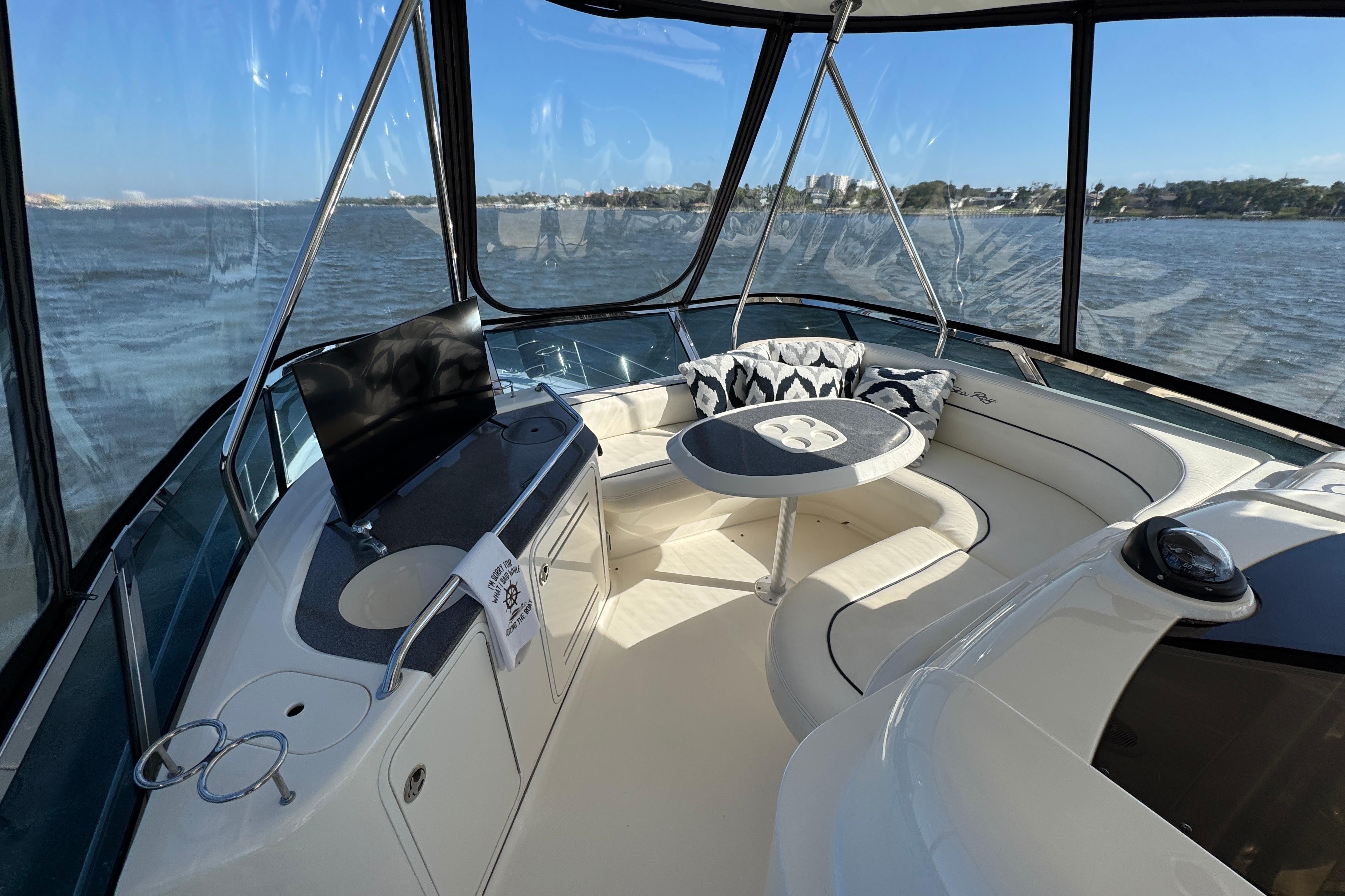 Luxurious interior of 2005 Sea Ray 500 Sedan Bridge yacht with panoramic windows.