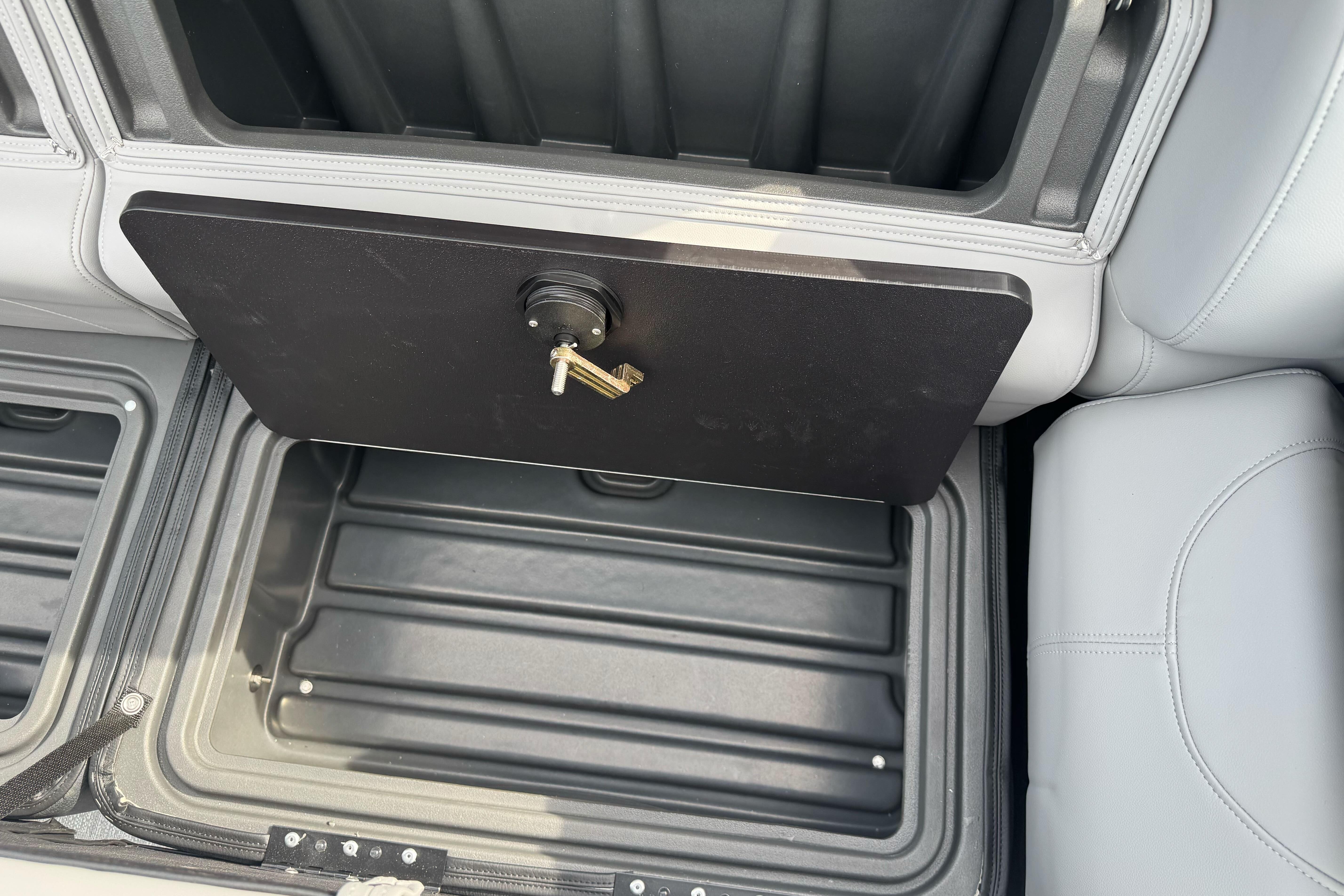 Storage compartment with lock and key in 2026 Regency 250 DL boat.