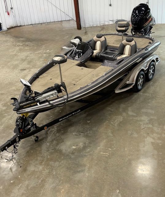 2011 Ranger Z520 Comanche boat on trailer in warehouse.