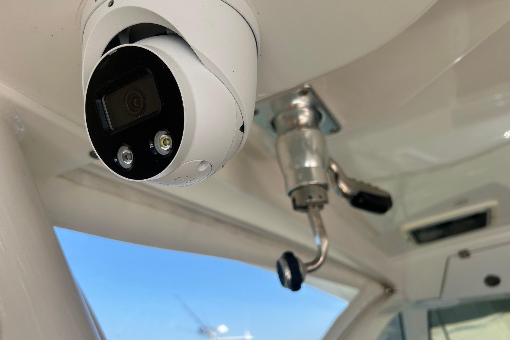 Security camera and handle inside a 2019 Pursuit OS 355 Offshore boat.
