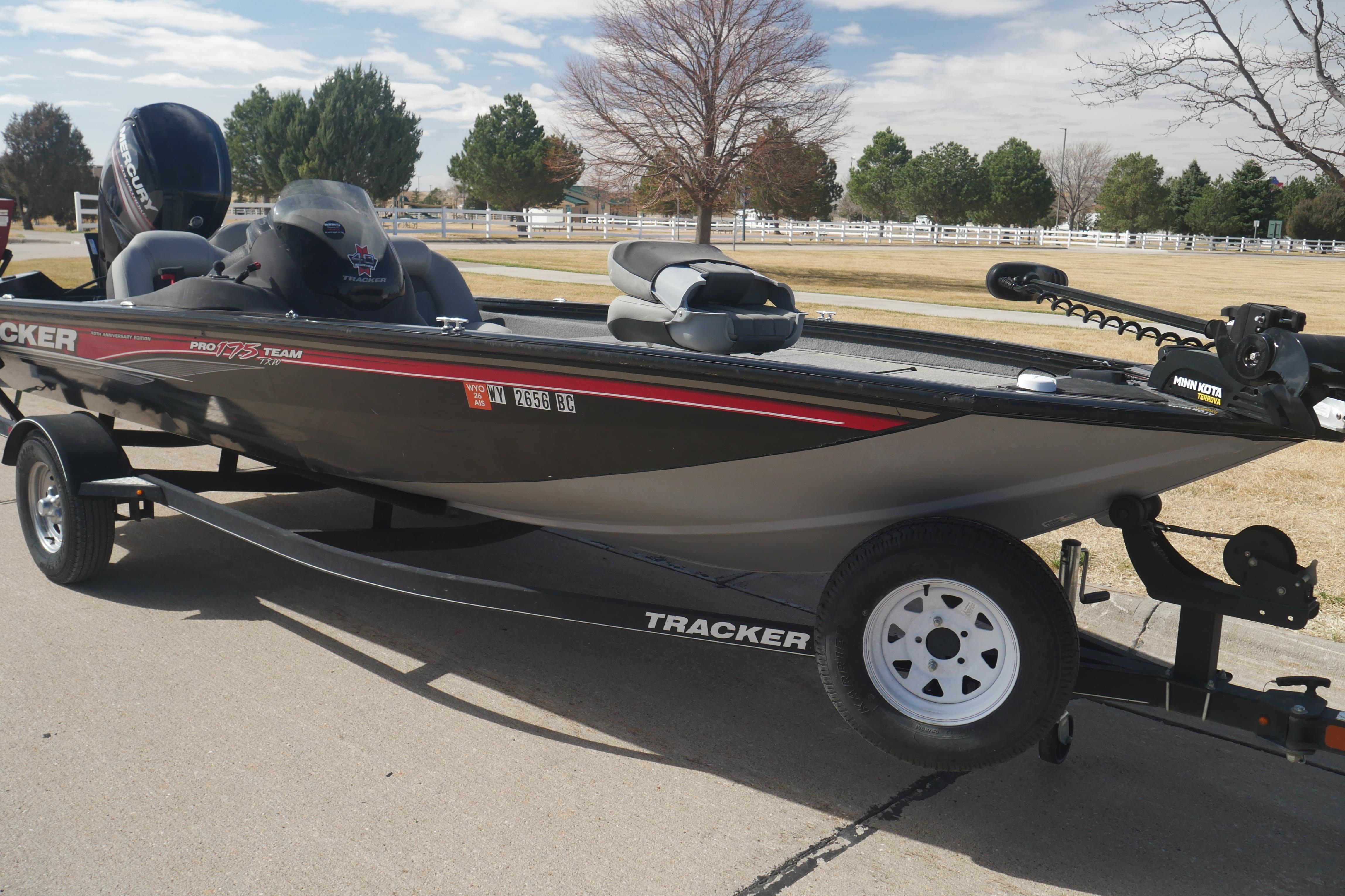 2018 Tracker Pro Team 175 TXW fishing boat on trailer, parked outdoors.
