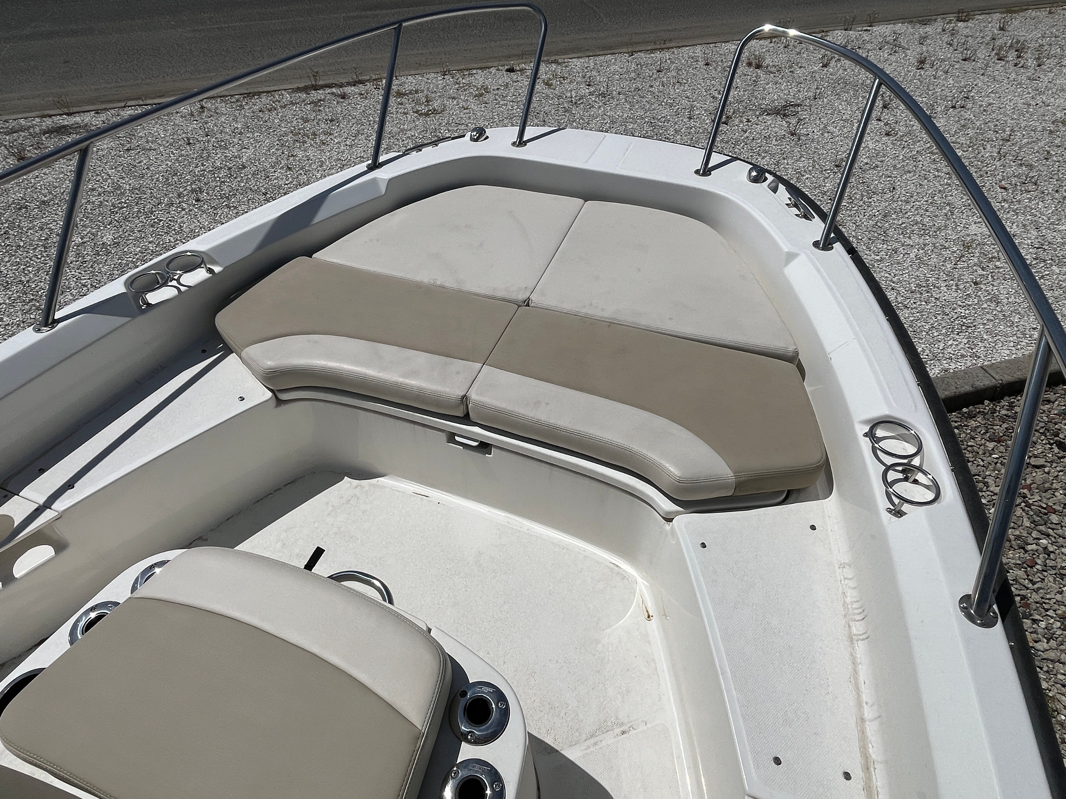 2017 Boston Whaler 210 Dauntless with cushioned seating areas.