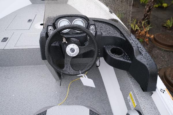 2024 Crestliner 1600 Vision boat dashboard with steering wheel and gauges.