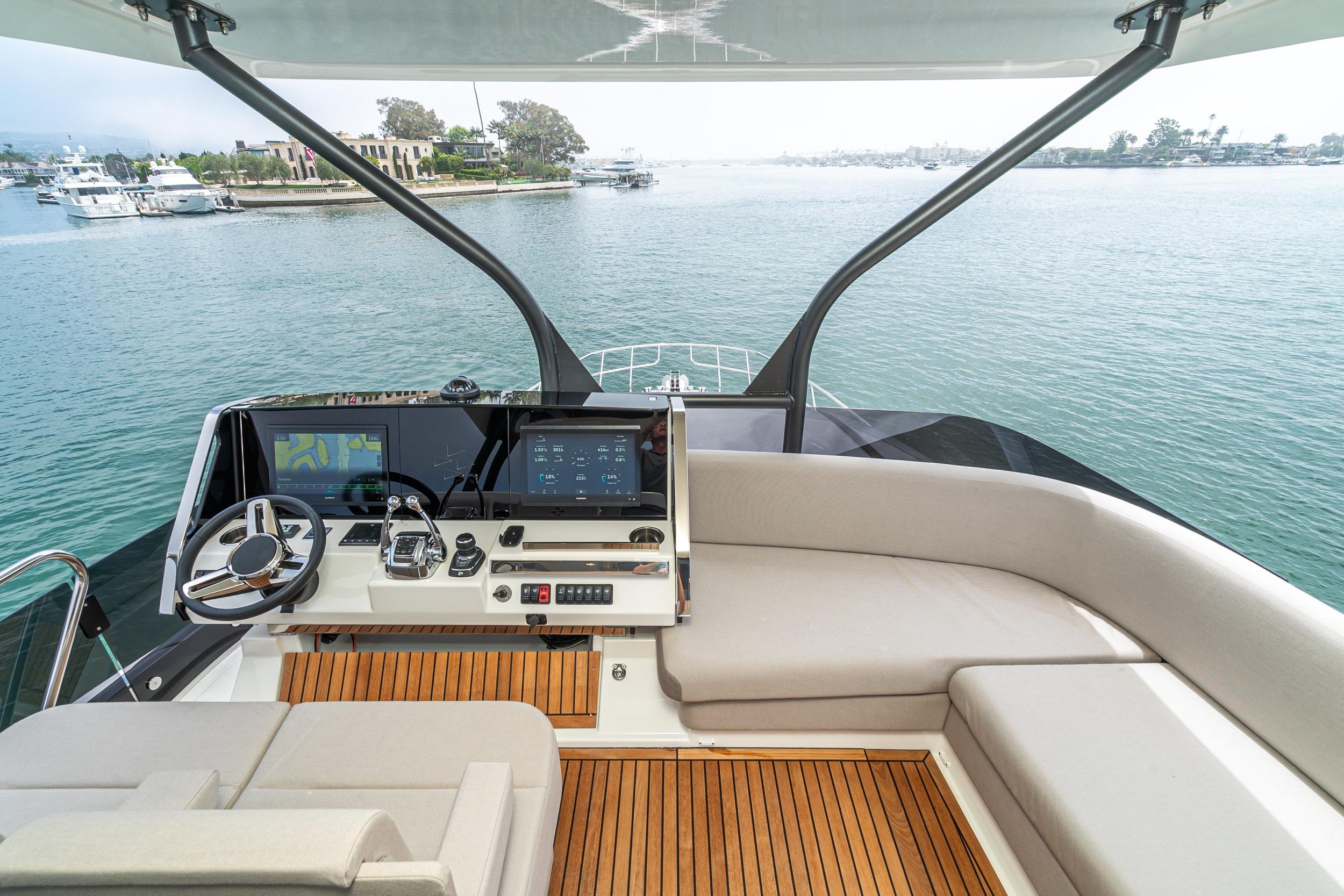 Luxurious 2024 Prestige X60 yacht helm with modern navigation system and elegant seating.