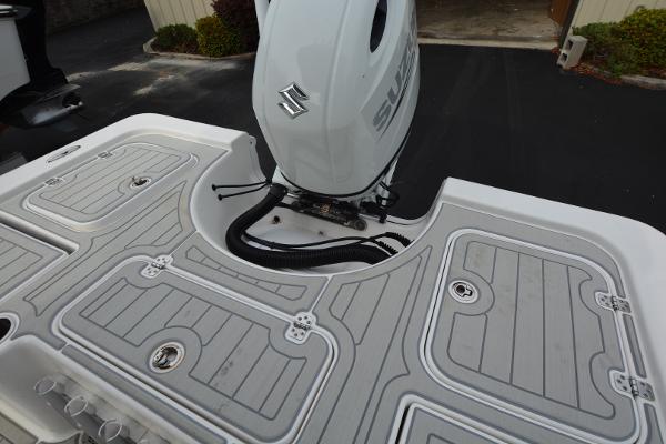 2021 Sea Pro 228 Bay boat with Suzuki outboard motor, featuring a sleek deck design.