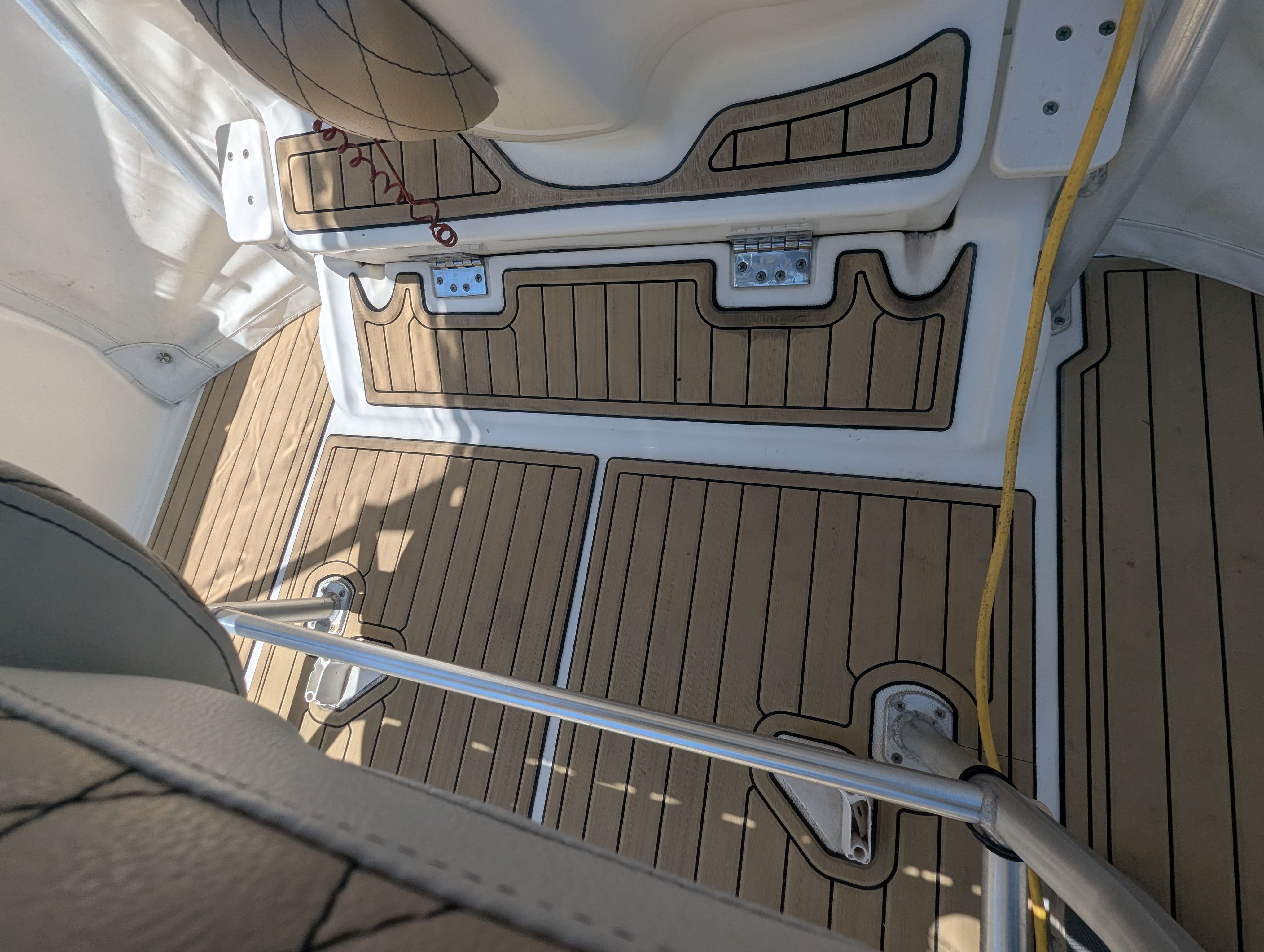 Interior of a 2005 Wellcraft 35 CCF boat with wooden flooring.