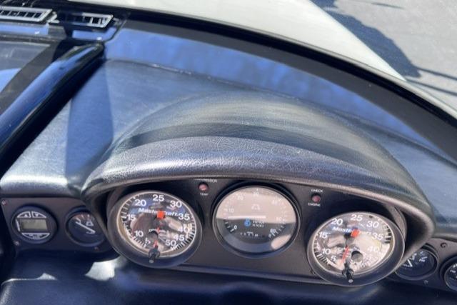 Dashboard of a 1996 MasterCraft ProStar 190 boat with gauges and controls.