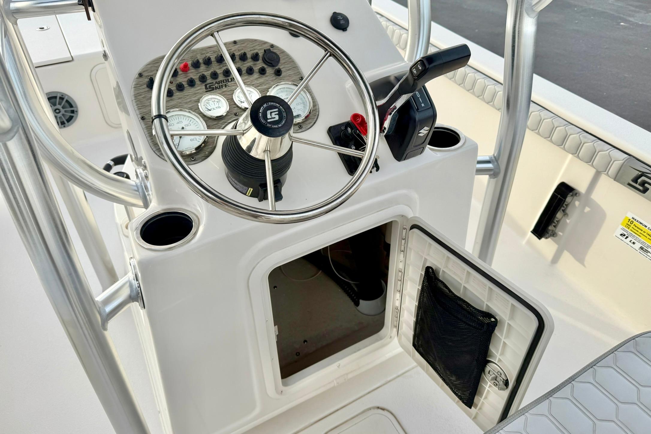 2025 Carolina Skiff 21 LS boat console with steering wheel and control panel.