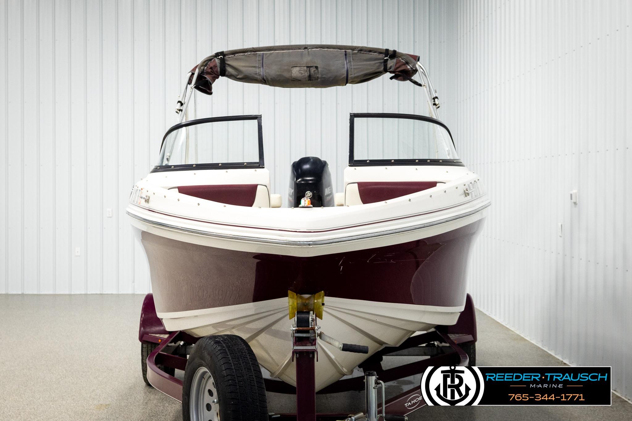 2016 Tahoe 450 TS boat on trailer in indoor storage facility.