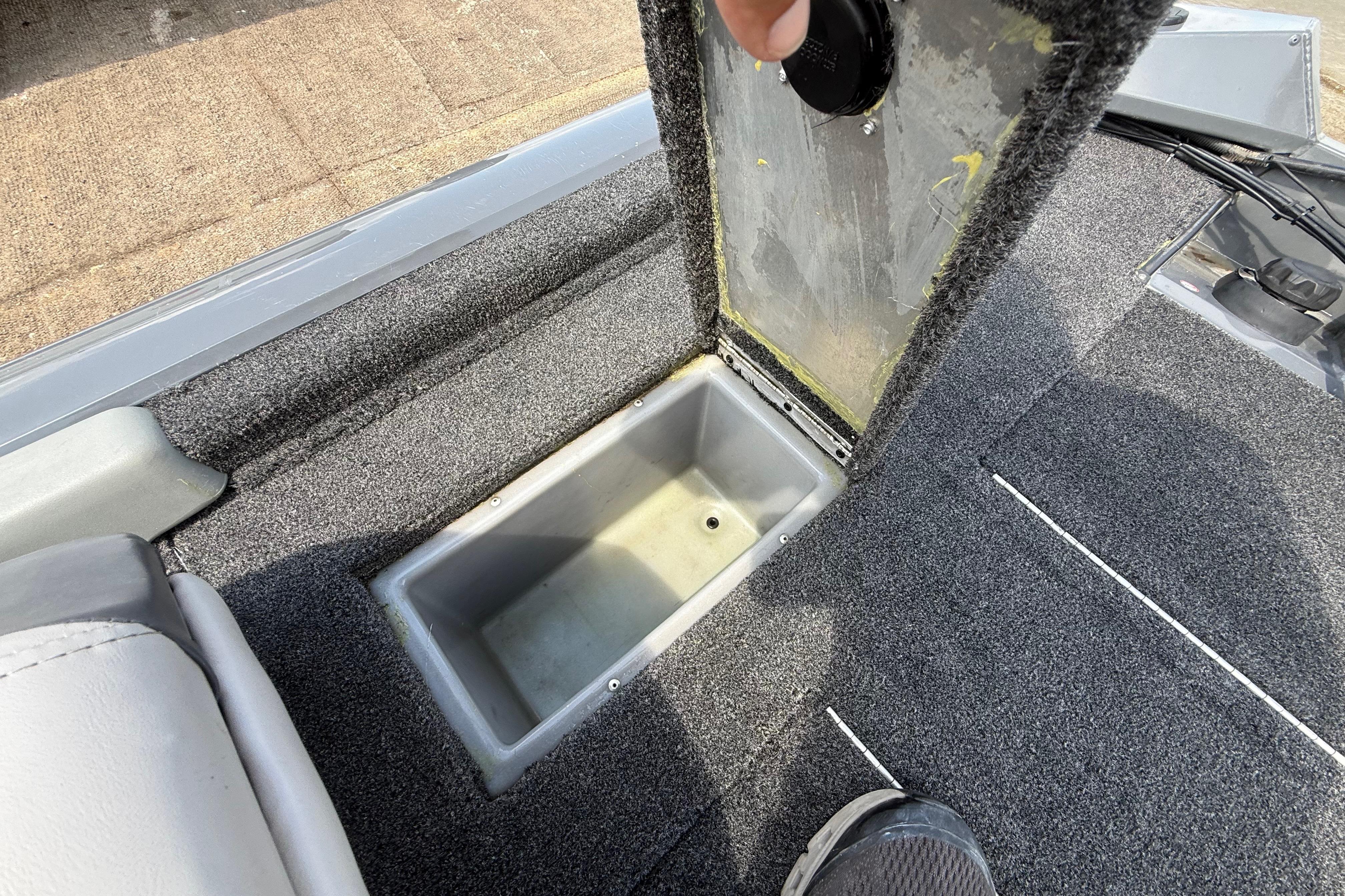 2015 Tracker Pro Team 190 TX boat storage compartment with open lid.