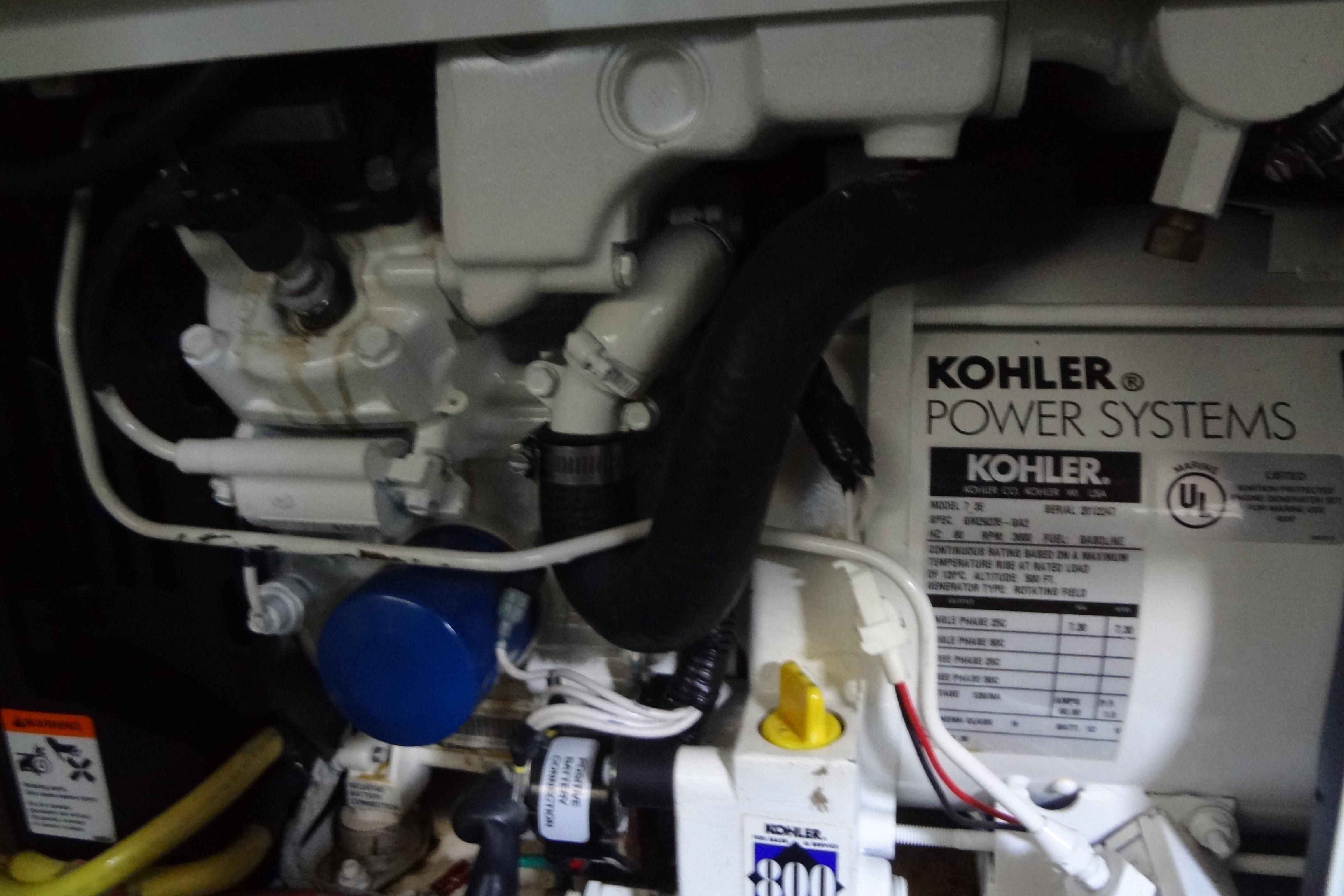 Engine compartment of a 2005 Silverton 34 Convertible with Kohler power system.