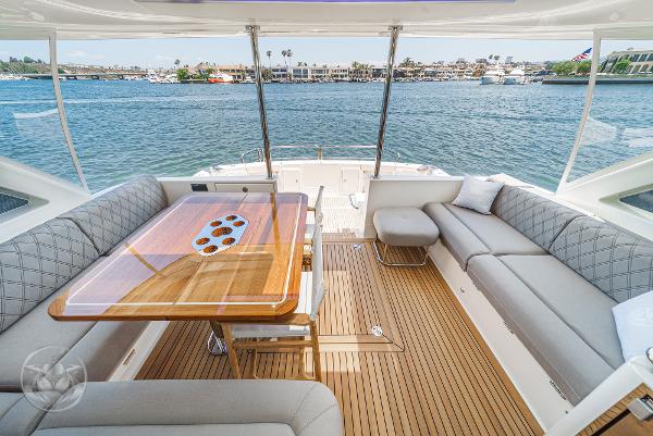 Luxurious 2025 Riviera 645 SUV yacht interior with waterfront view.