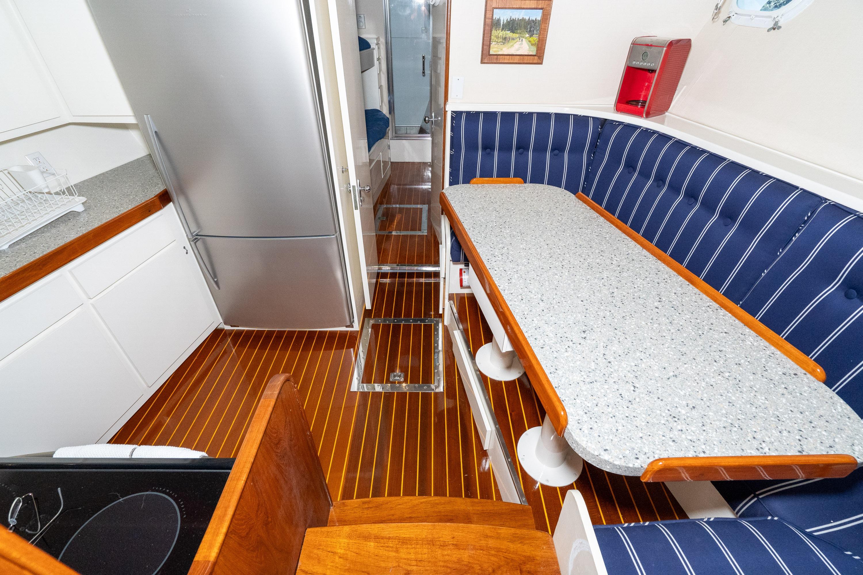 Looking forward from salon to galley area with dinette.
