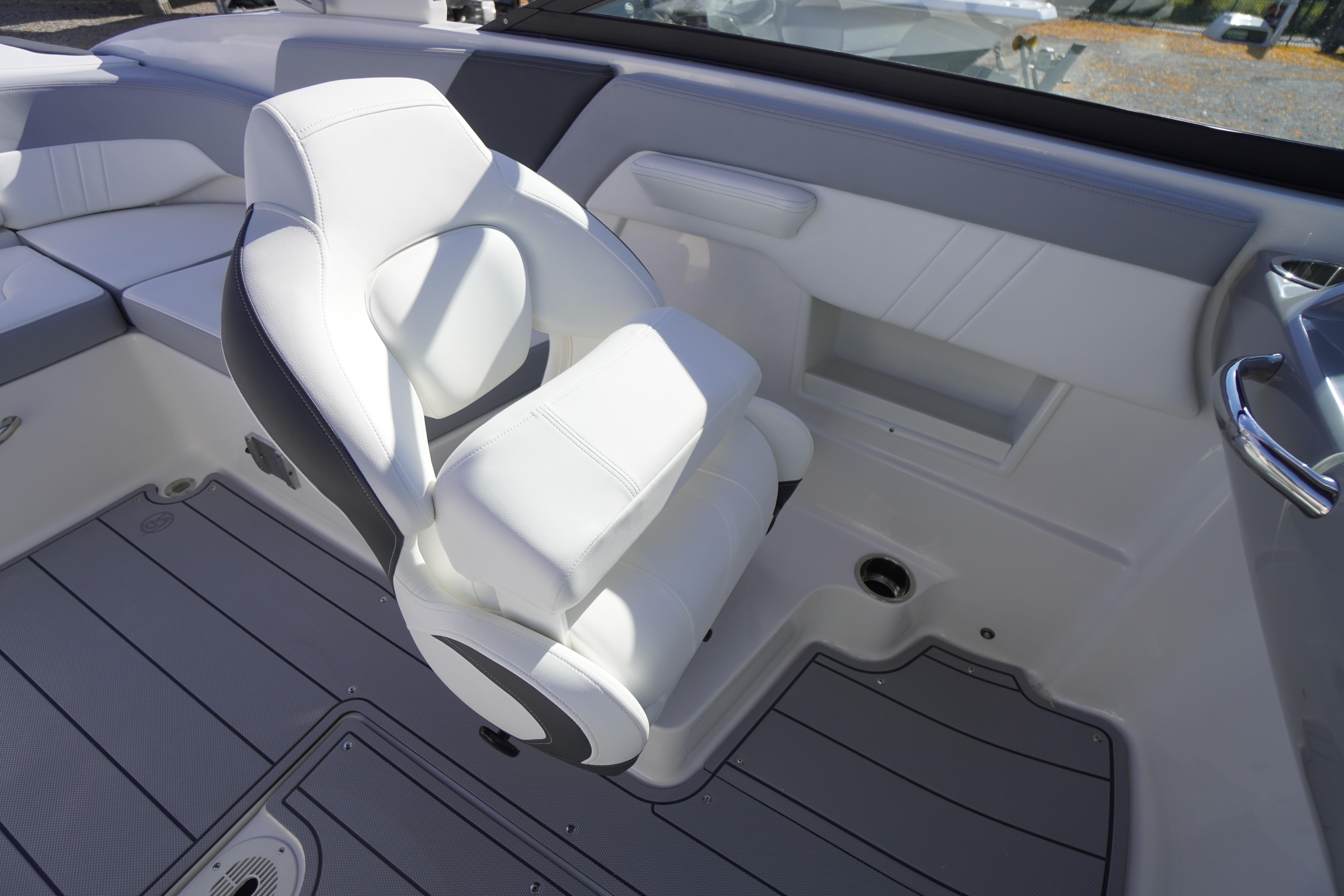 2026 Chaparral 23 SSi OB boat interior with white seating and sleek design.