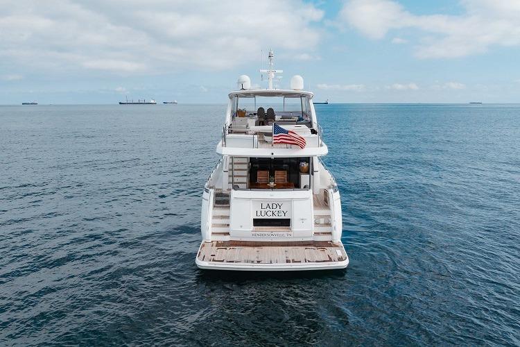 Luxury Princess 2017 yacht "Lady Luckey" on open sea with American flag.