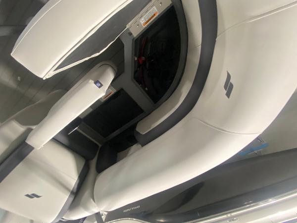2024 Starcraft EXS 1 boat interior seating with white and gray upholstery.