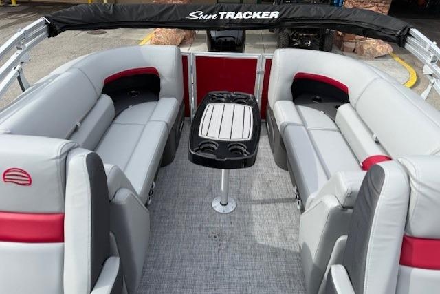 2026 Sun Tracker Party Barge 22 DLX with spacious seating and central table.