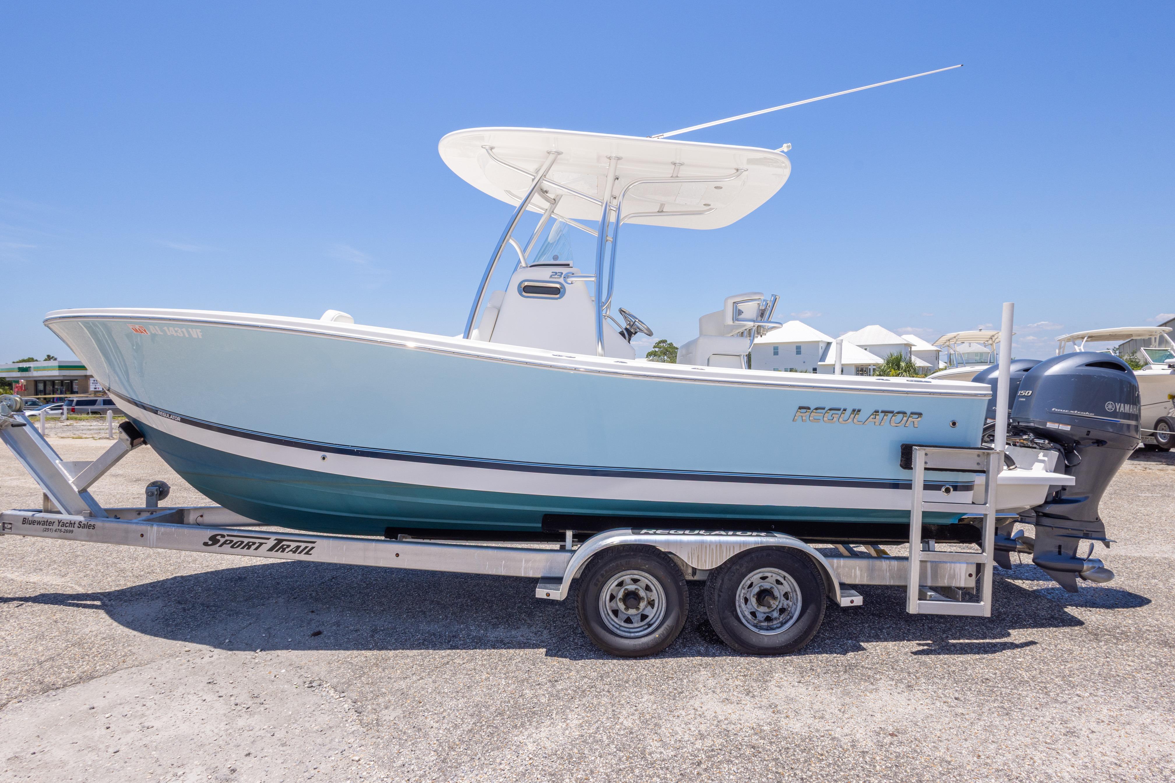 2019 Regulator 23 Center Console boat on trailer, clear sky background.