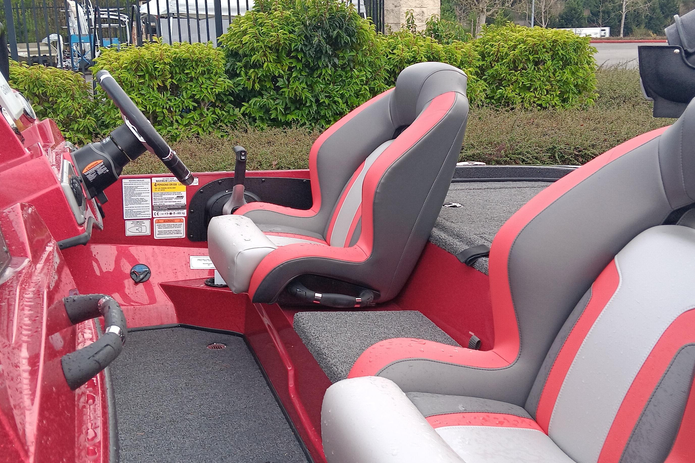 Interior of 2026 Nitro Z18 Pro boat with red and gray seating.