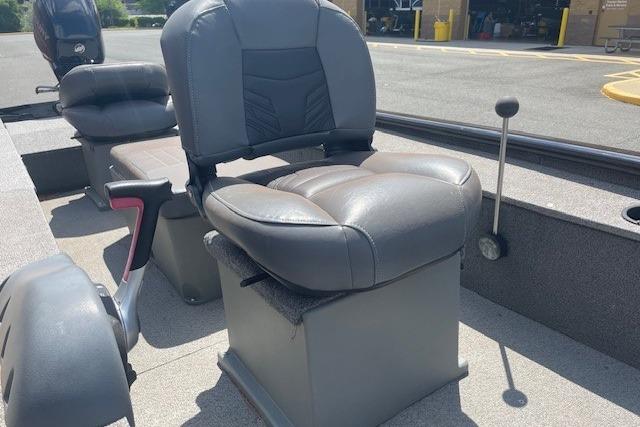 2019 Tracker Panfish 16 boat interior with cushioned seating and steering controls.