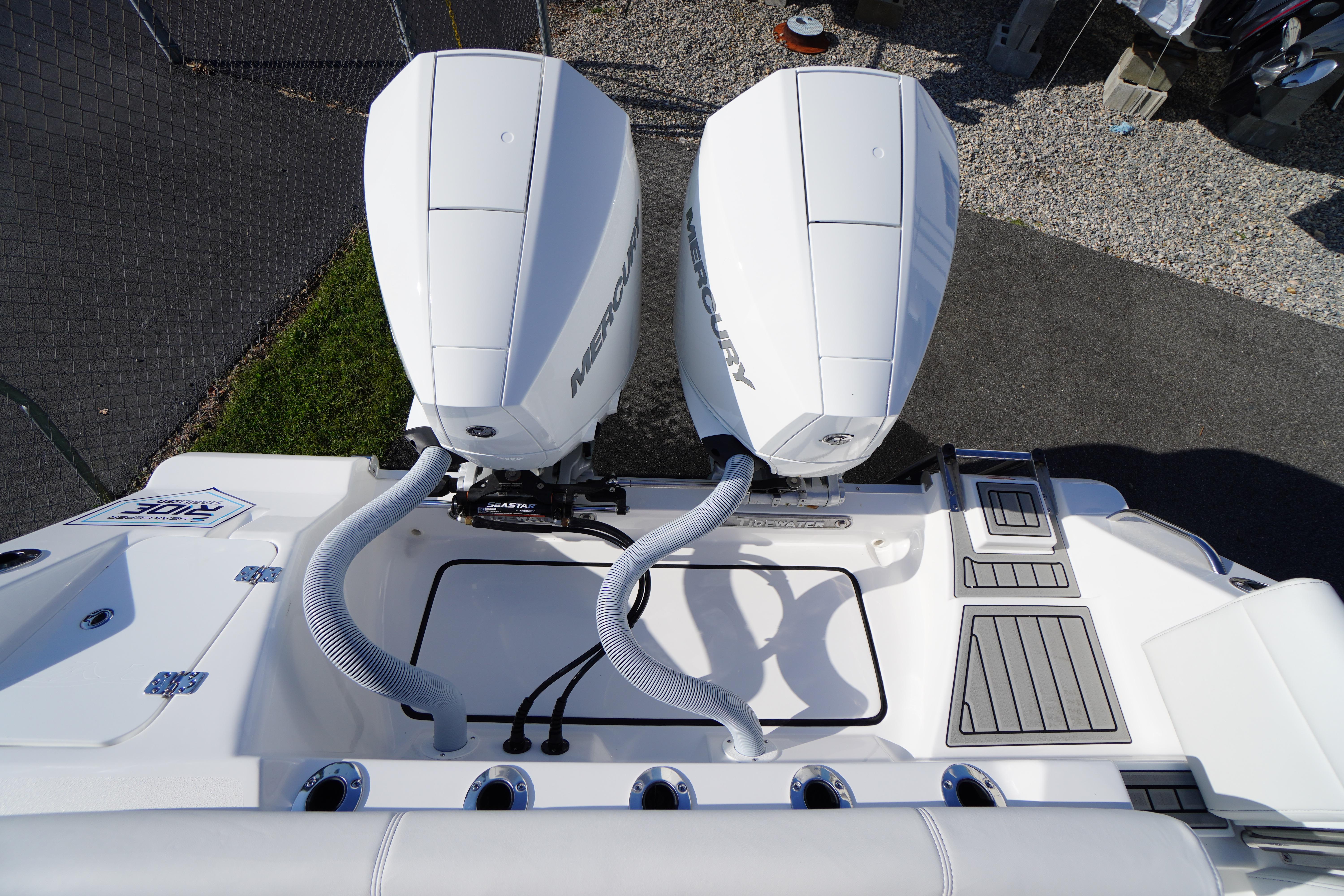 2026 Tidewater 272 LXF boat with dual Mercury outboard engines, top view.