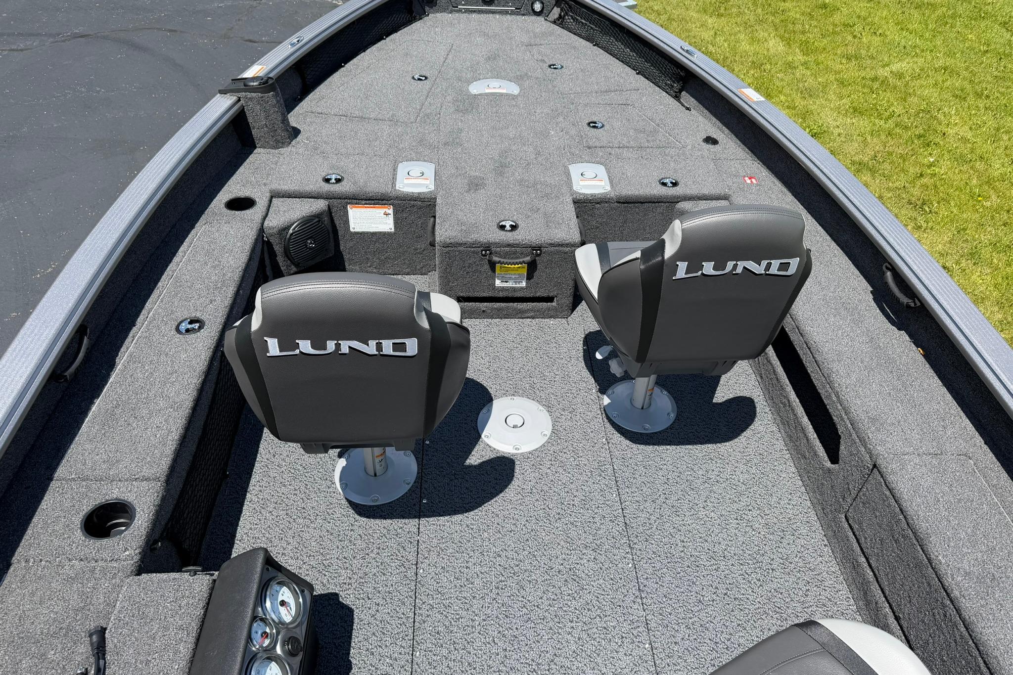 2027 Lund 1875 Pro Guide boat interior with two seats and carpeted deck.