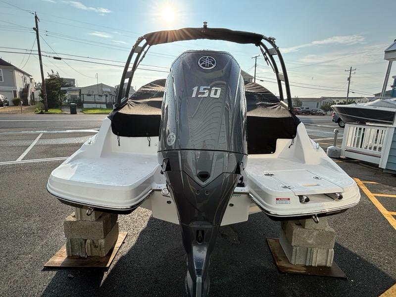 2026 Regal 21 OBX boat with Yamaha 150 outboard motor, parked on blocks.