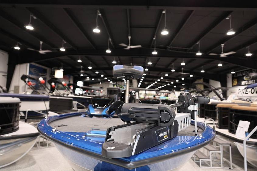 2026 Vexus AVX 2085S boat displayed in a showroom with modern lighting.