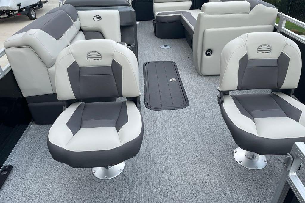 2026 Sun Tracker Fishin' Barge 22 XP3 interior with gray and white seating.