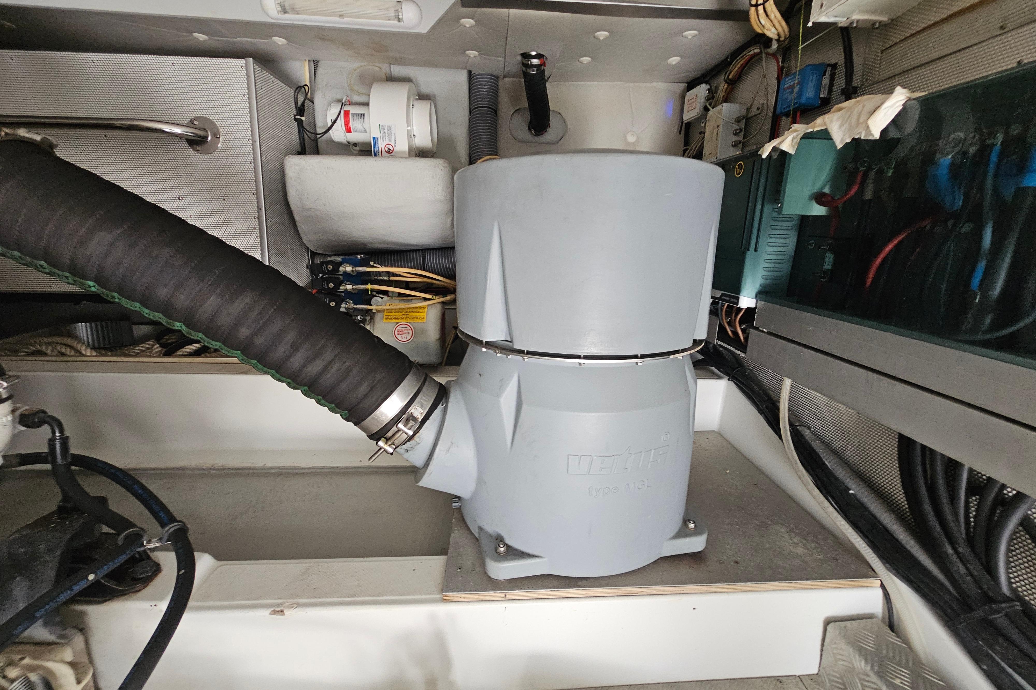 Engine room of 2011 Beneteau Swift Trawler 52 with mechanical components and wiring.