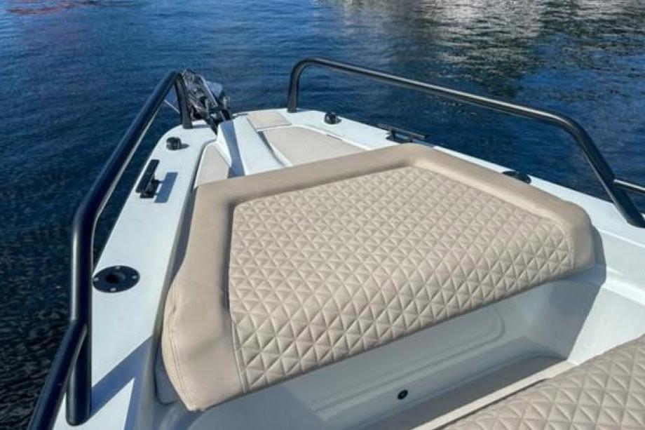2023 BRABUS Shadow 900 ST boat with luxurious quilted seating on calm water.