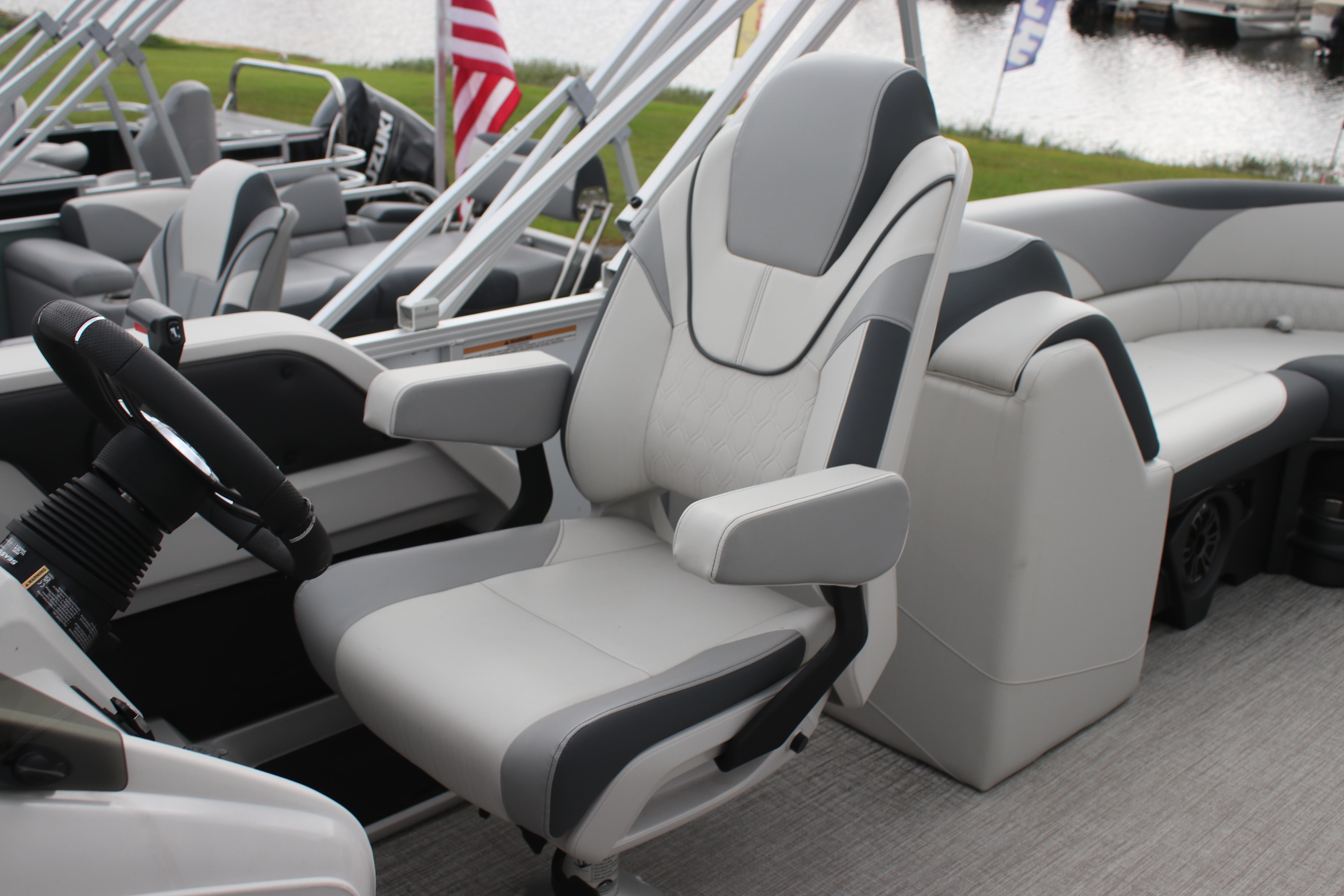2025 Avalon LSZ Quad Lounger boat interior with plush seating and steering wheel.