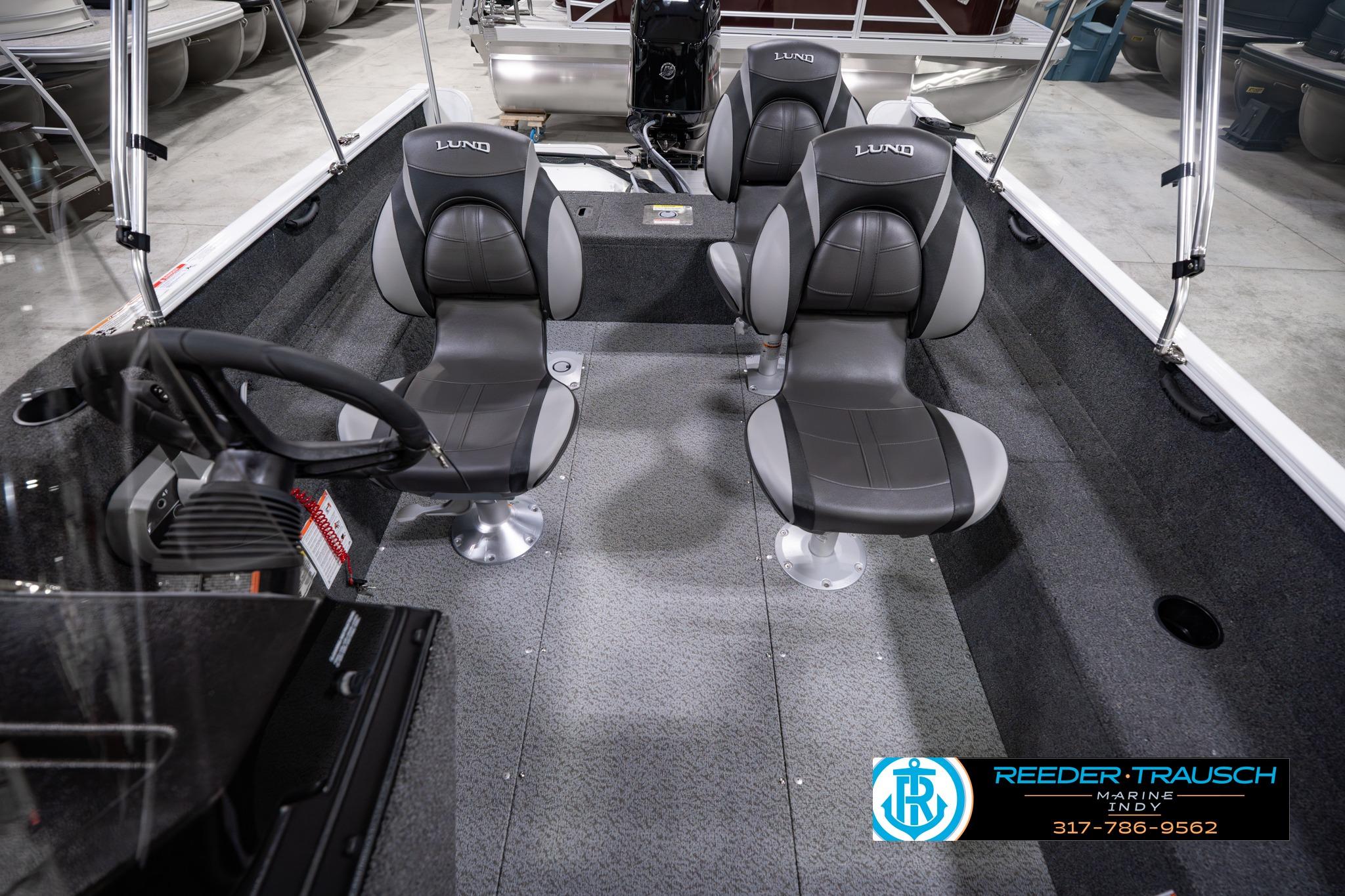 2026 Lund 1650 Rebel XL SS boat interior with gray seating and steering wheel.
