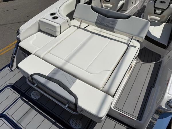 2023 Chaparral 267 SSX boat with luxurious white seating and sleek design.