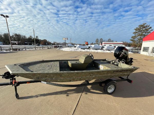 2024 Tracker Grizzly 1648 SC boat on trailer in outdoor lot.