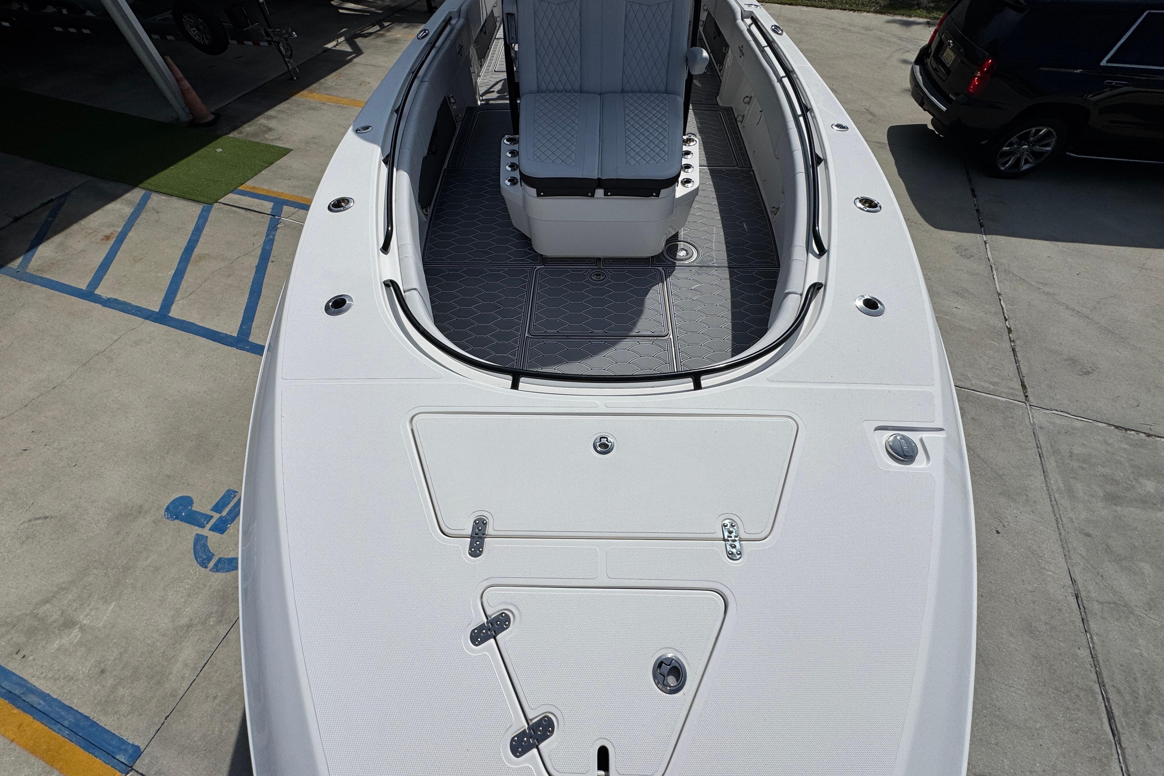 2023 Fountain 34 Tournament Edition boat, top view, parked on concrete surface.
