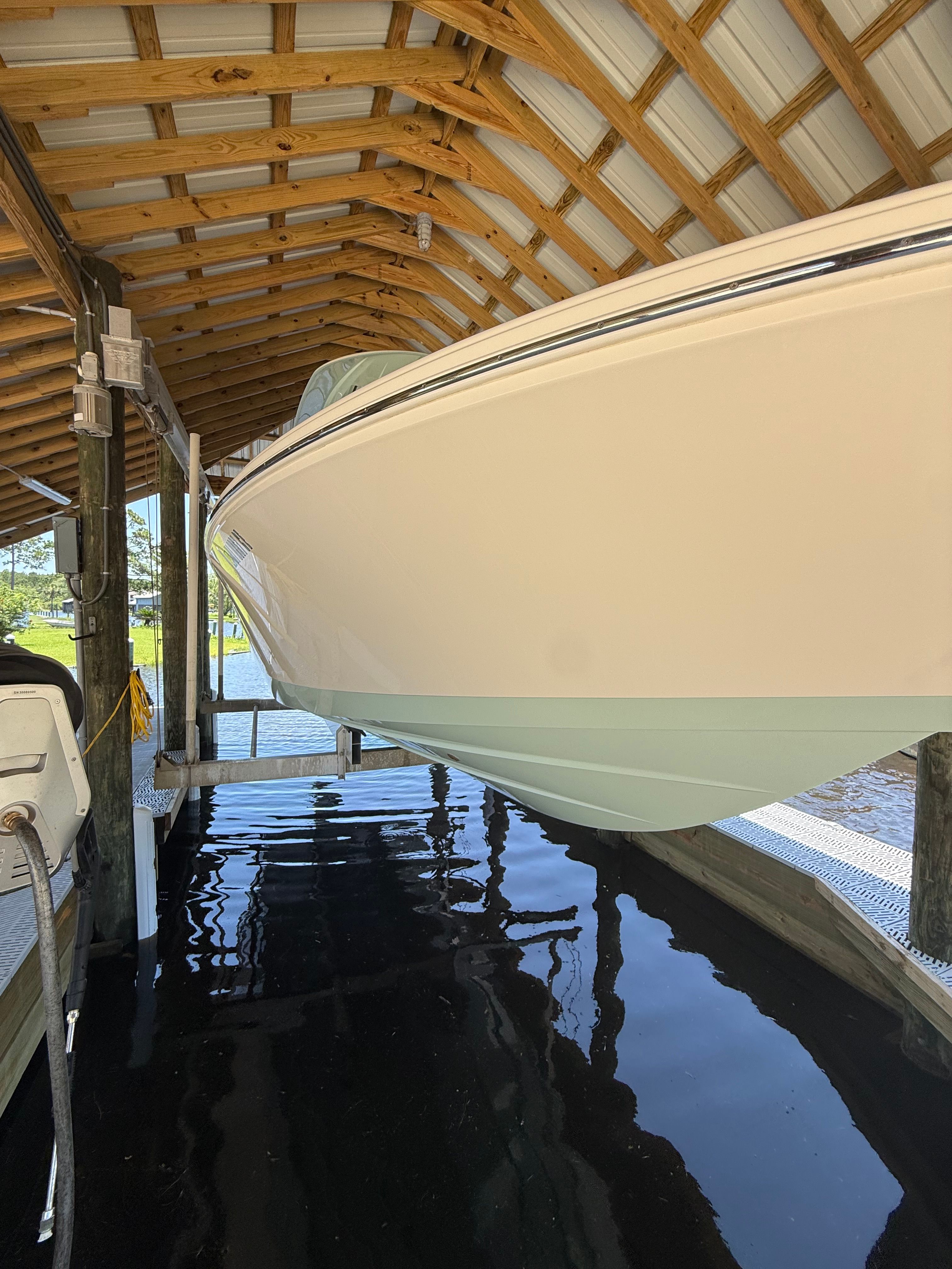2024 Pathfinder 2700 Open boat in covered dock.