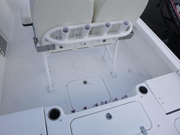 2025 Sea Pro 230 Bay boat interior with rod holders and storage compartments.