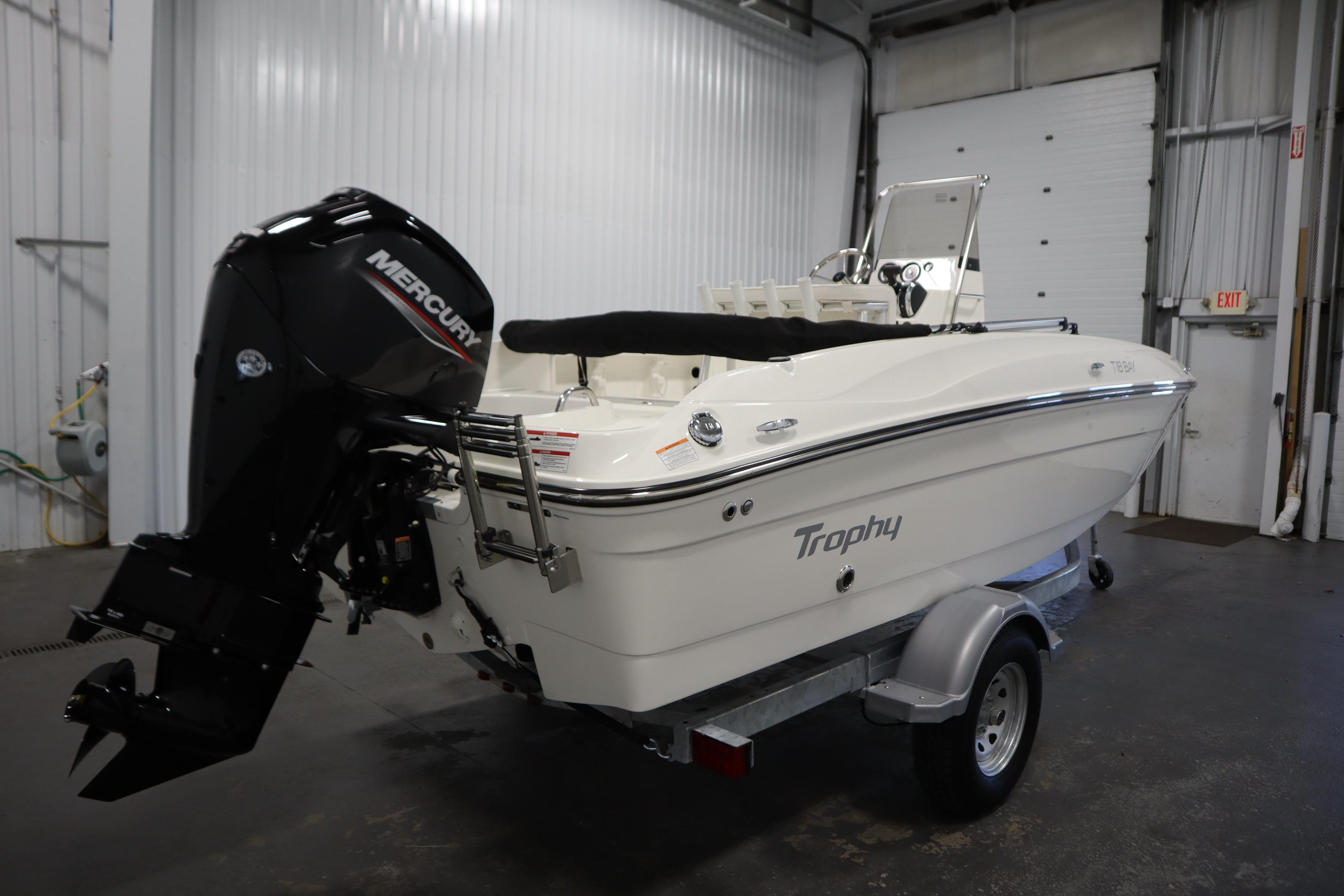 2026 Bayliner Trophy T18 boat with Mercury engine on trailer in garage.