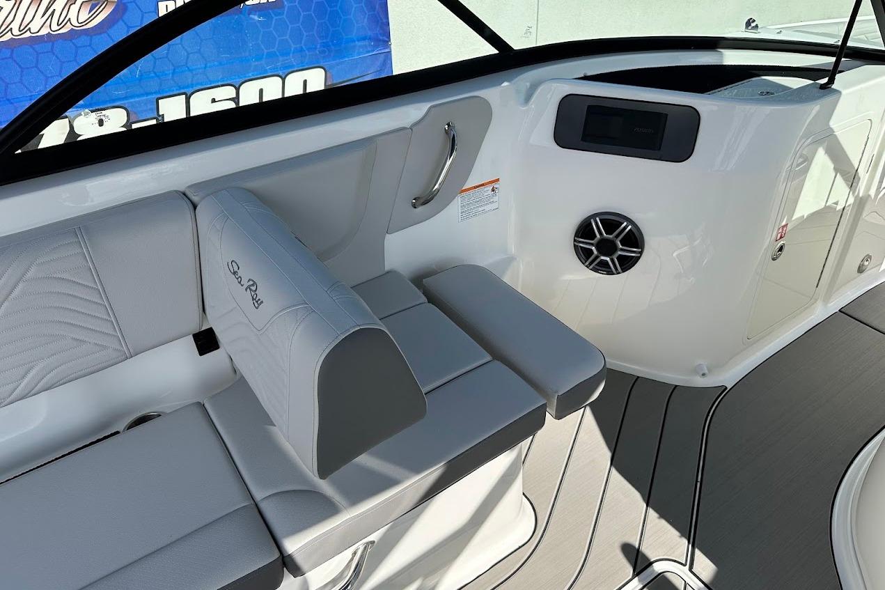 2026 Sea Ray SDX 230 Surf boat interior with gray seating and modern dashboard.