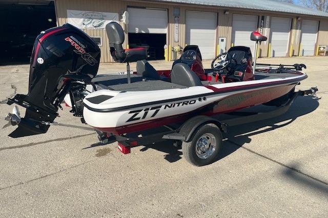 2026 Nitro Z17 boat with powerful outboard motor, parked outdoors.