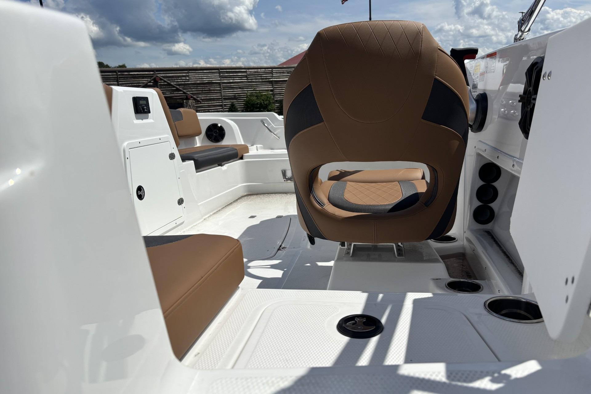 Interior of 2026 Tahoe 1950 boat with brown seating and modern design.