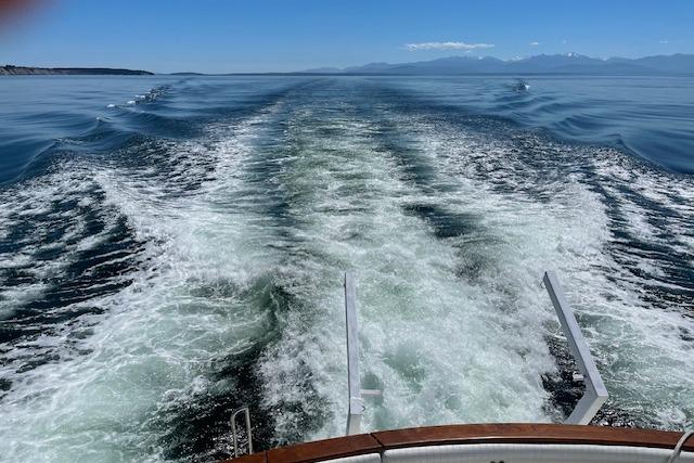 Wake of 1991 Californian 52 Cockpit Motor Yacht cruising on open water.