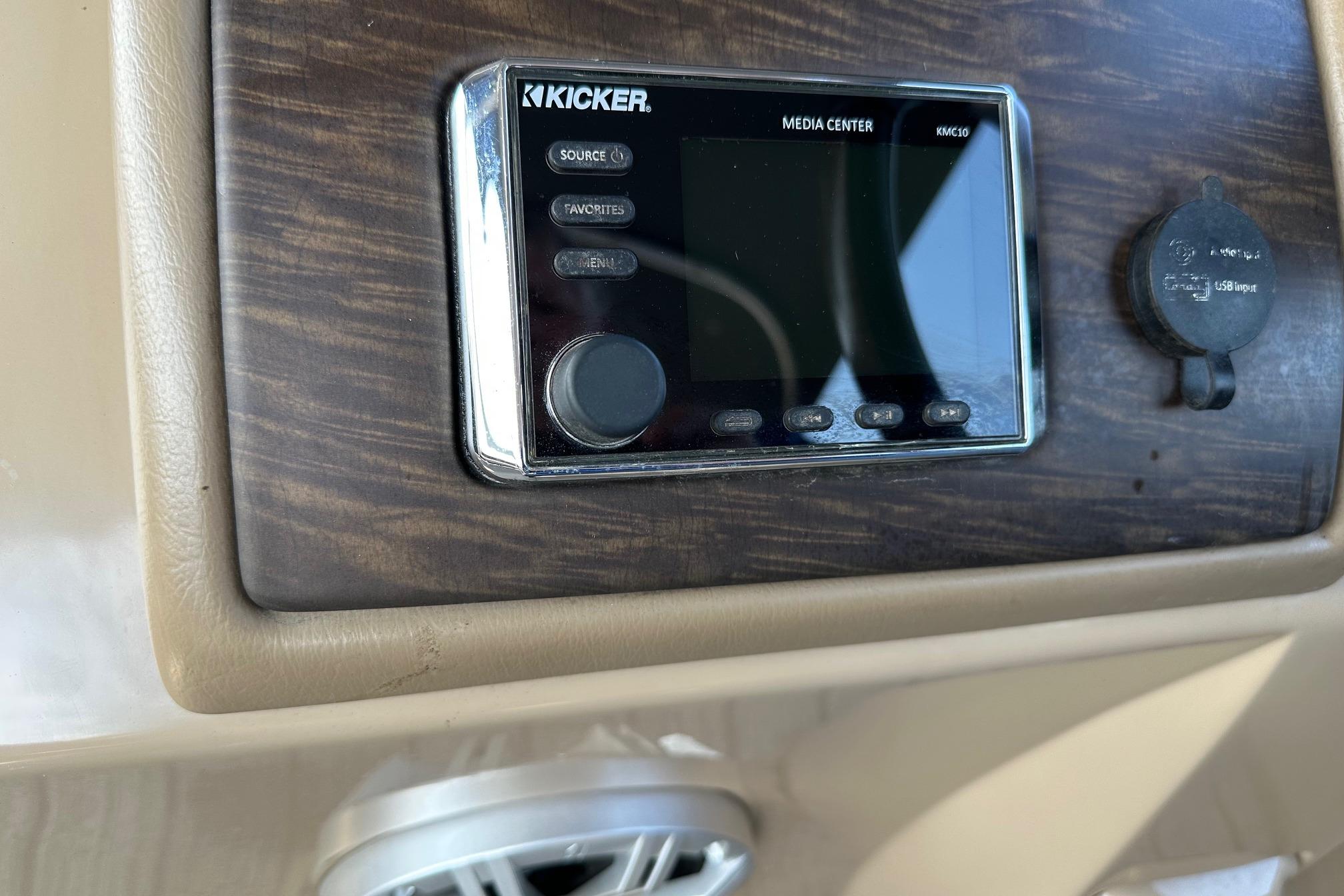 Kicker media center on 2017 Bennington 22 GPD boat dashboard.