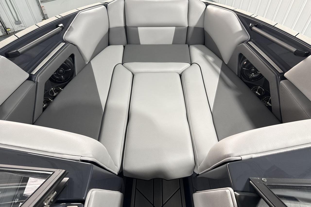 Interior of a 2026 Moomba Craz with gray upholstery and speakers.