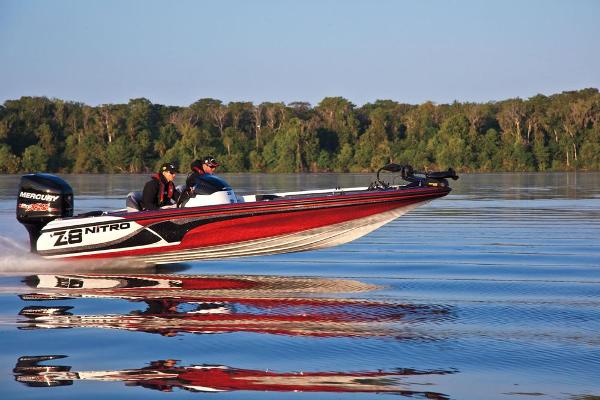 Manufacturer Provided Image: 2013 Nitro Z-8 boat speeding on a calm lake with lush green forest backdrop.