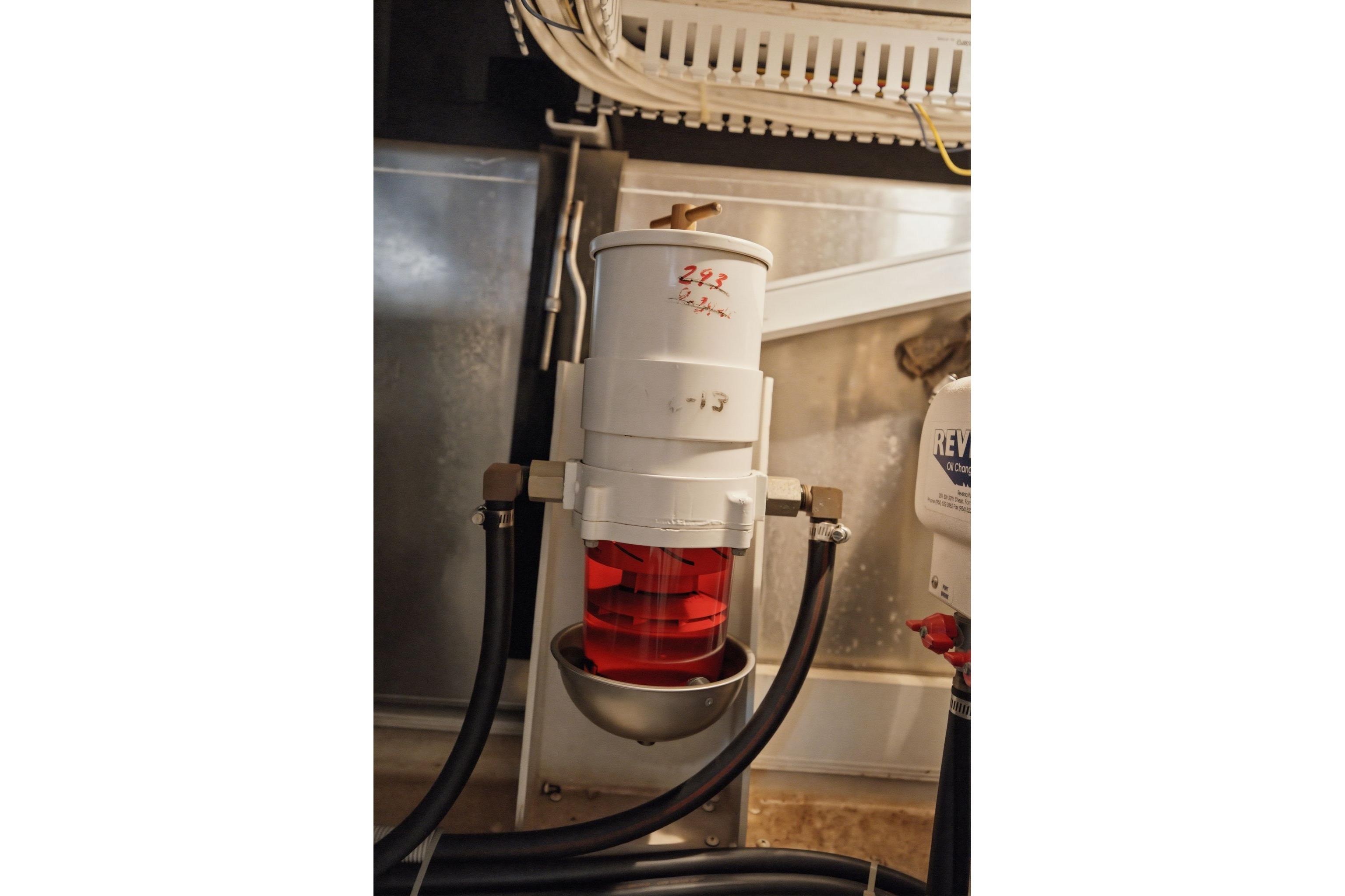 Engine room of 2005 Carver 39 Motor Yacht with fuel filter system.